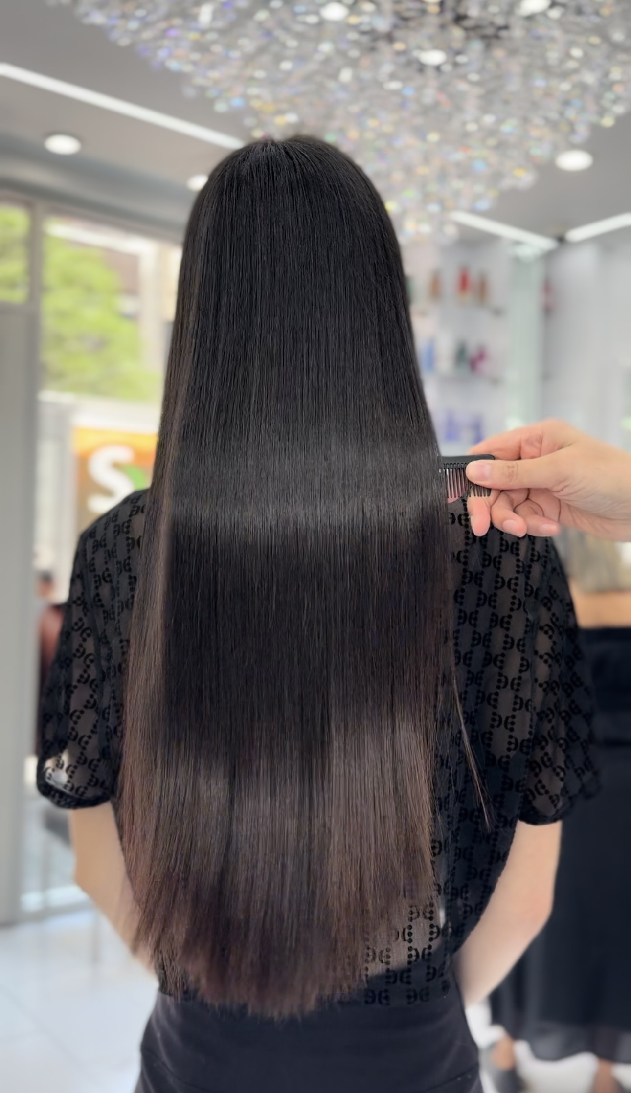 Long smooth dark hair at 23rd Street Hair Salon